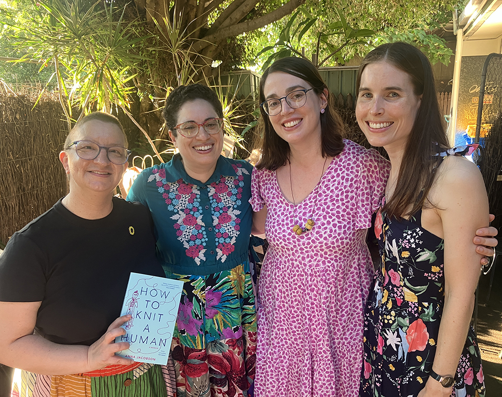Anna's group of crafternoon friends who are all smiling.