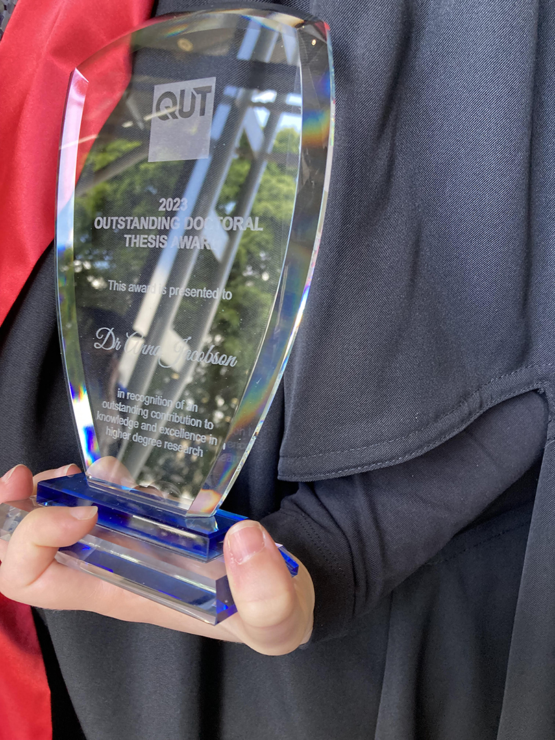 The Outstanding Doctoral Thesis Award glass trophy that is inscribed with the words: This award is presented to Dr Anna Jacobson in recognition of an outstanding contribution to knowledge and excellence in higher degree research